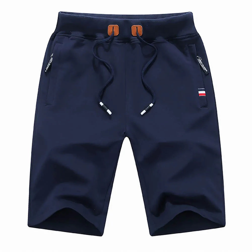 Pantalones cortos para hombre de verano, confeccionados en algodón, estilo casual y deportivo. Diseño holgado tipo jogger con bolsillos, inspirado en la moda urbana Hip Hop y Streetwear. Ideales para la playa, el ocio y el uso diario.