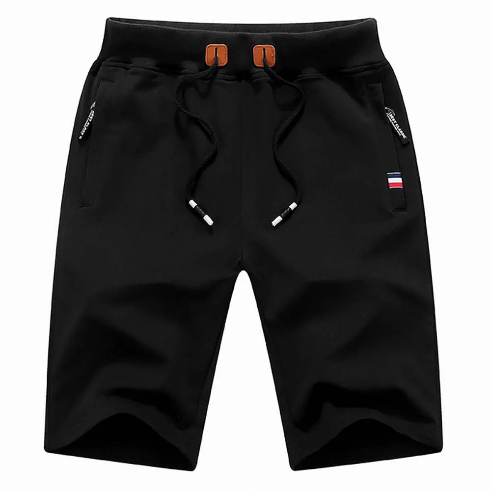 Pantalones cortos para hombre de verano, confeccionados en algodón, estilo casual y deportivo. Diseño holgado tipo jogger con bolsillos, inspirado en la moda urbana Hip Hop y Streetwear. Ideales para la playa, el ocio y el uso diario.