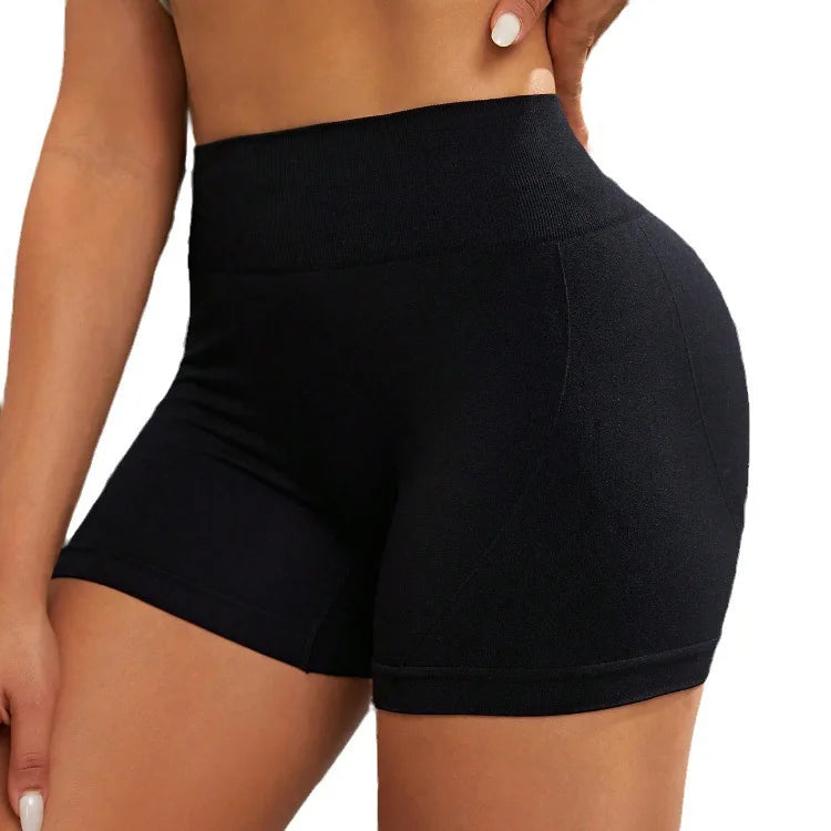 Shorts deportivos para mujer tipo ciclista. Ajustados, transpirables y de cintura alta. Ideales para fitness, yoga y entrenamiento, ofreciendo comodidad y libertad de movimiento.