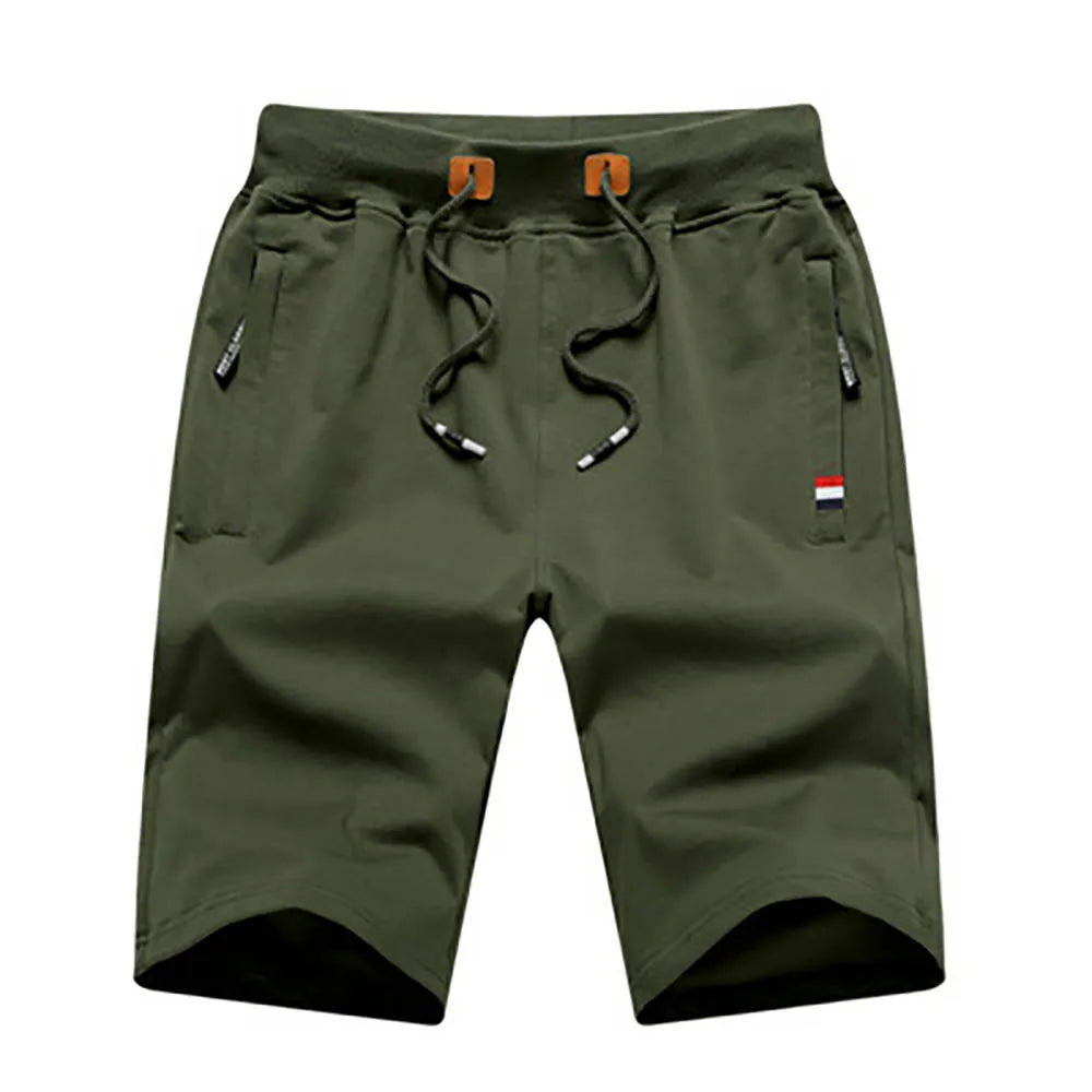 Pantalones cortos para hombre de verano, confeccionados en algodón, estilo casual y deportivo. Diseño holgado tipo jogger con bolsillos, inspirado en la moda urbana Hip Hop y Streetwear. Ideales para la playa, el ocio y el uso diario.