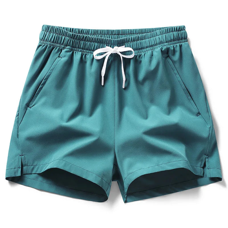 Shorts deportivos de tendencia 2026 para hombre y mujer. Diseño tipo running y pantalón corto, con bolsillos con cremallera. Estilo versátil, ideal para uso diario, deporte y outfits en pareja.