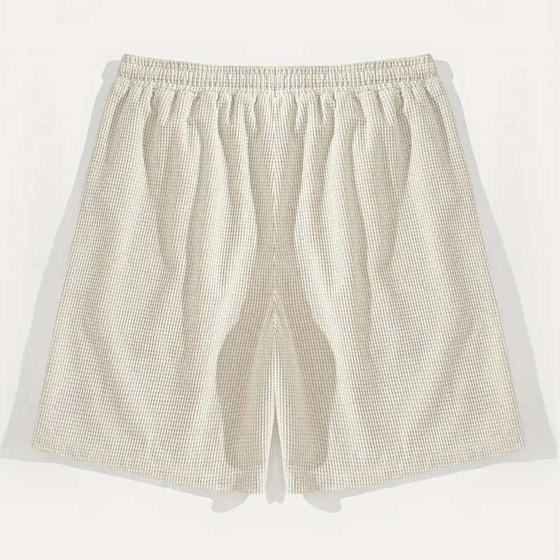 Shorts para hombre de estilo casual y deportivo. Fabricado en tejido texturizado transpirable, ideales para uso diario, playa y actividades deportivas. Diseño moderno y cómodo para un look versátil.
