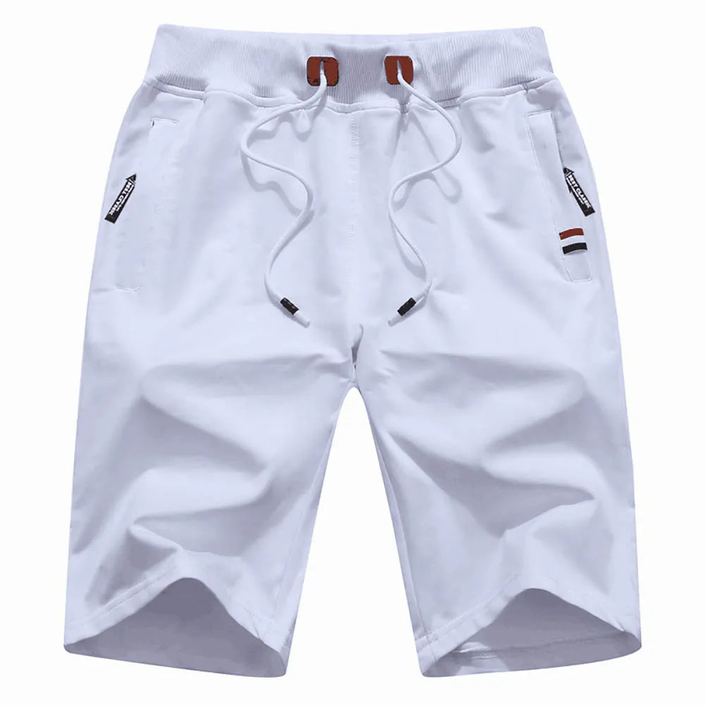 Pantalones cortos para hombre de verano, confeccionados en algodón, estilo casual y deportivo. Diseño holgado tipo jogger con bolsillos, inspirado en la moda urbana Hip Hop y Streetwear. Ideales para la playa, el ocio y el uso diario.